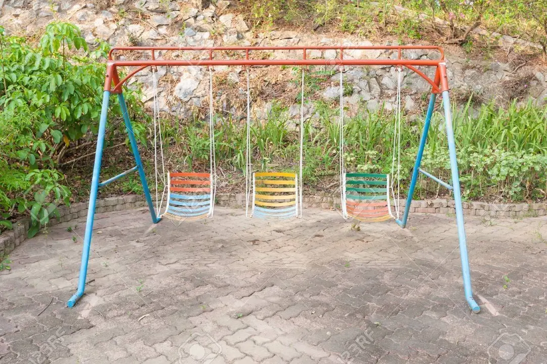 swings for children with garden background