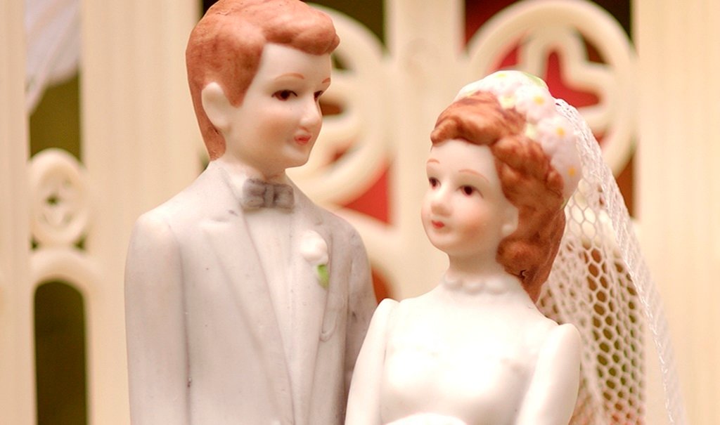 A bride and groom wedding cake topper.