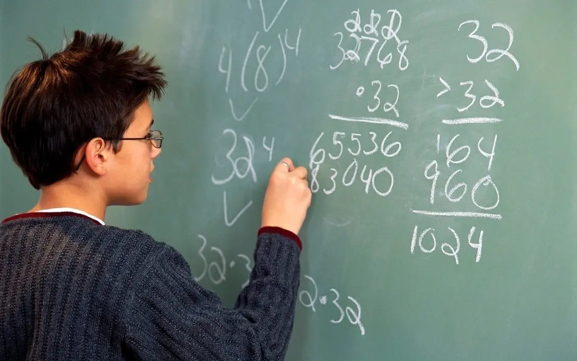 Performing Math Calculations at Chalkboard