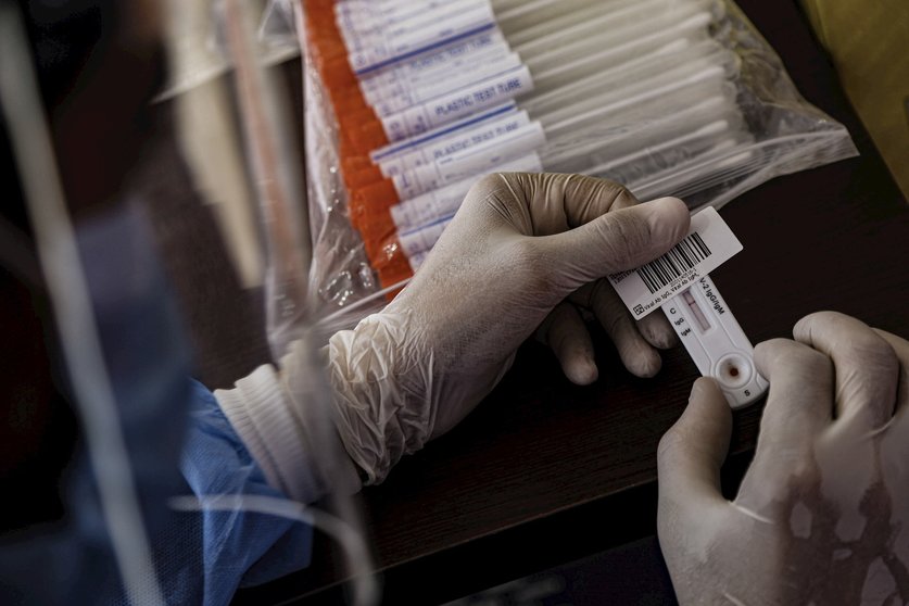 16 June 2020, Egypt, Cairo: A health worker holds swab samples collected from people at a drive-through coronavirus (COVID-19) testing unit inside the parking lot of Ain Shams University Specialized Hospital.