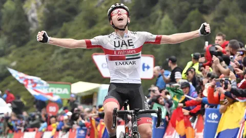 01 September 2019, Spain, Ctra. dels Cortals d'Encamp: Slovenian cyclist Tadej Pogacar of UAE Team Emirates celebrates as he crosses the finish line to win the ninth stage of the 2019 edition of the "Vuelta a Espana" Tour of Spain cycling race, 94,4 km fr