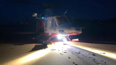 Heli de noche archivo