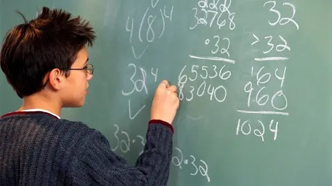 Performing Math Calculations at Chalkboard