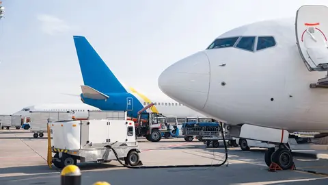 Refueling of the airplane before flight. Aircraft maintenance fuel at the airport outdoors. Plane, shipping, transportation concept
