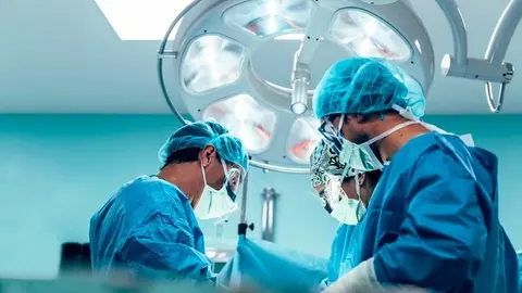 Team of Surgeons Operating in the Hospital.